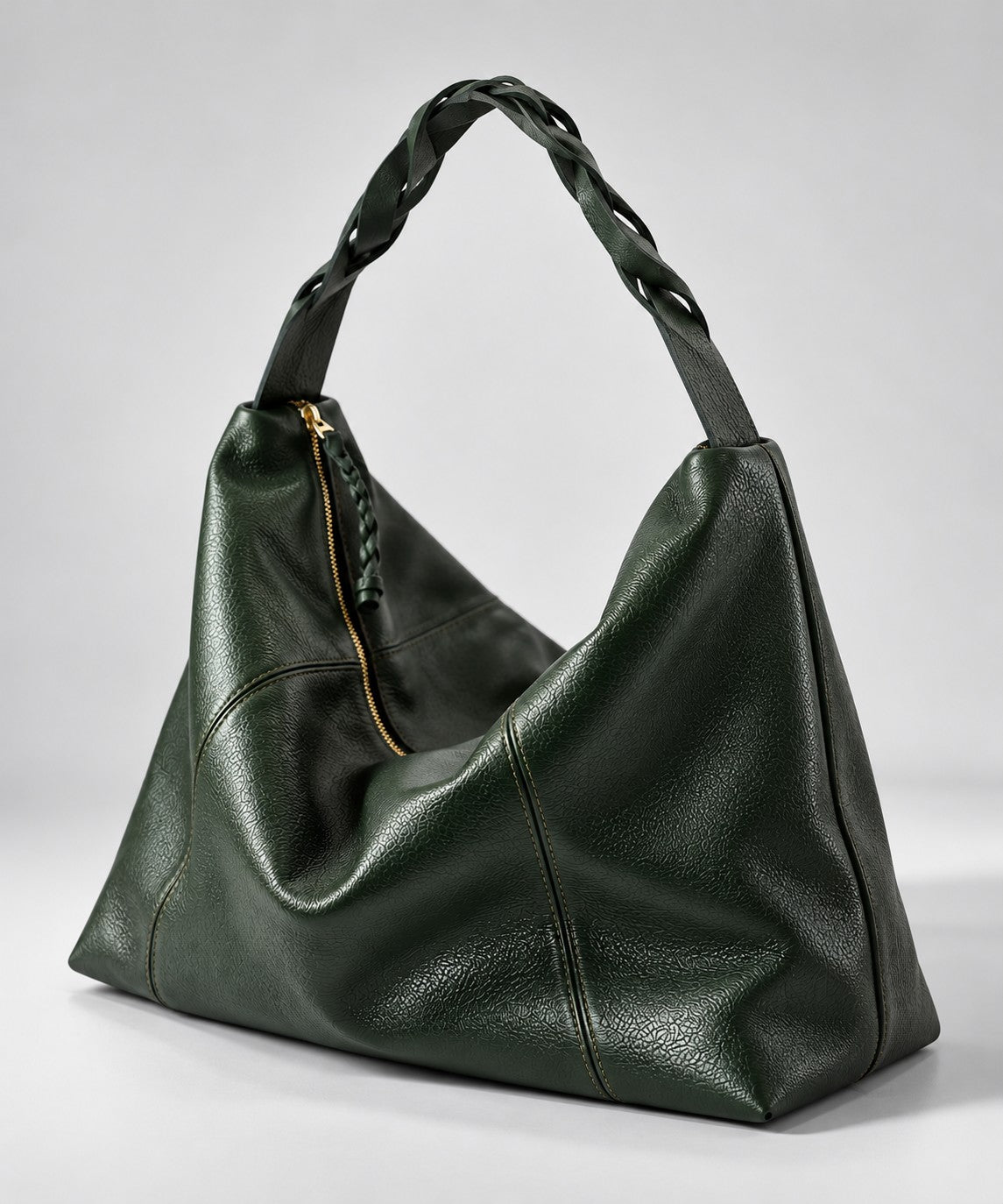 Bolso Trenza en cuero verde oscuro, vista lateral (imagen ilustrativa)