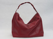 Bolso Trenza en cuero vino tinto, vista frontal con manija trenzada